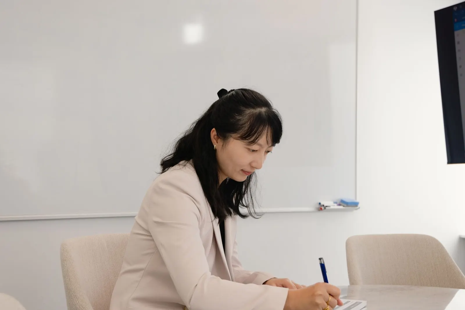 A Navigate Financial adviser preparing advice notes